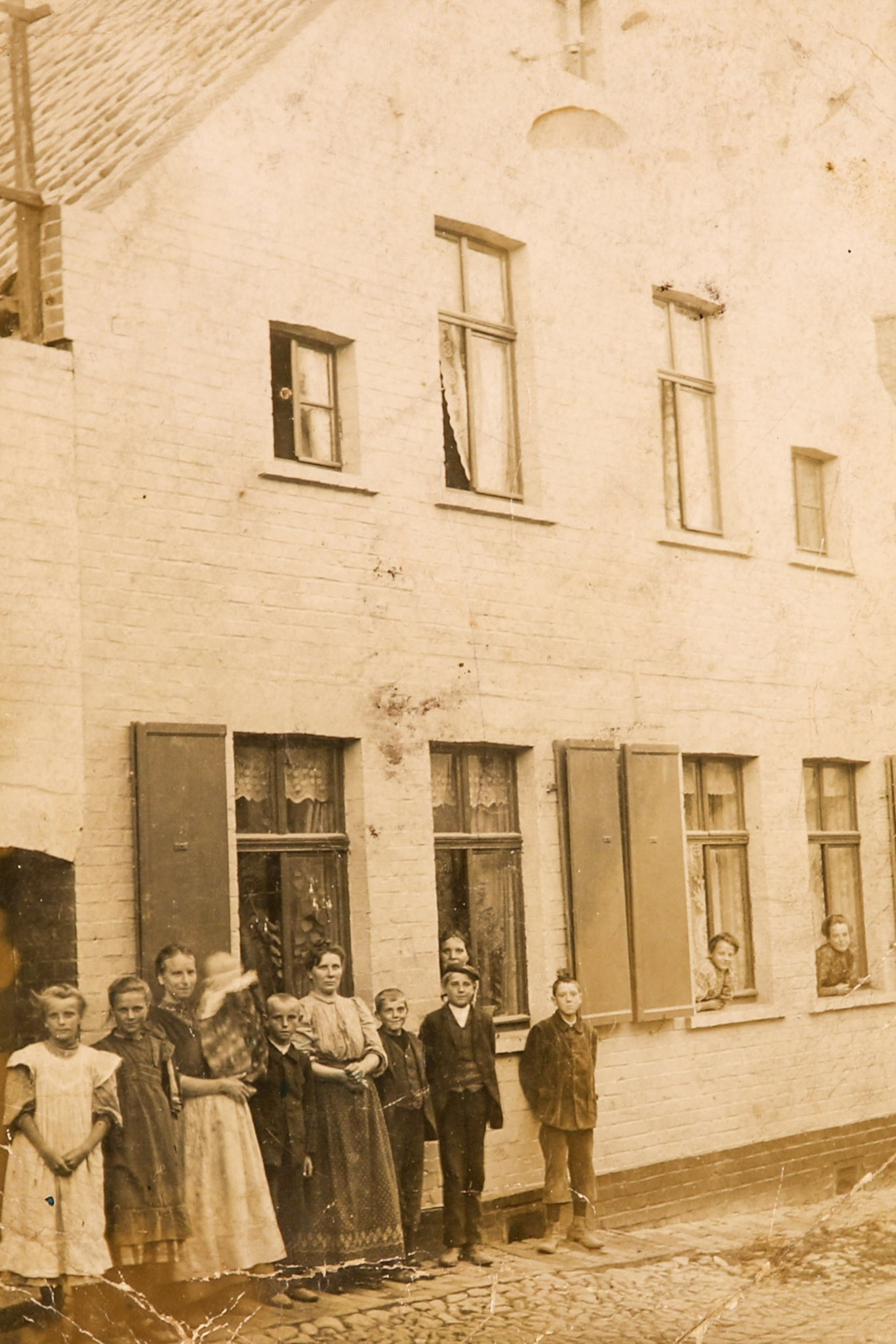 Refugees in front of the house